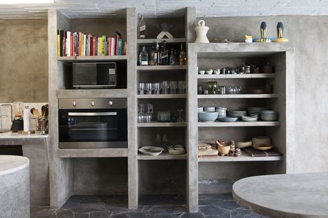 The concrete kitchen in Pedro Reyes and Carla Fernandez's Brutalist house in Mexico City via FvF | Remodelista Cement Kitchen, Brutalist House, Pedro Reyes, House In Mexico, Houses In Mexico, Concrete Interiors, Industrial Kitchen Design, Concrete Countertops Kitchen, Kabinet Dapur