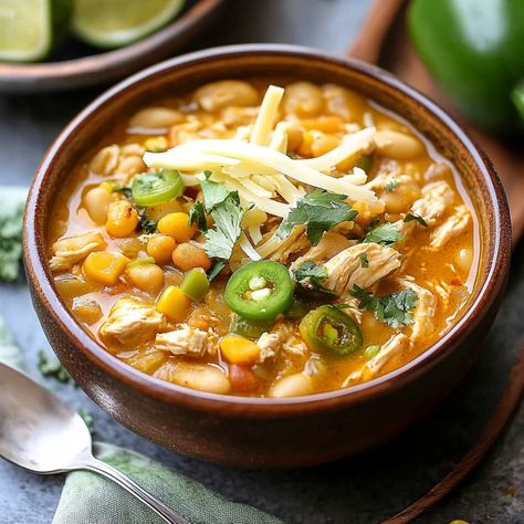 A hearty and flavorful Spicy White Chicken Chili with tender chicken, beans, and a spicy kick. Perfect for a cozy dinner. Ready in under an hour! Spicy Chicken Chili Recipe, Spicy White Chicken Chili, Spicy Chicken Chili, Creamy White Beans, Spicy Chicken Soup, Chicken Beans, White Chicken Chili Slow Cooker, White Chicken Chili Recipe, White Bean Chili