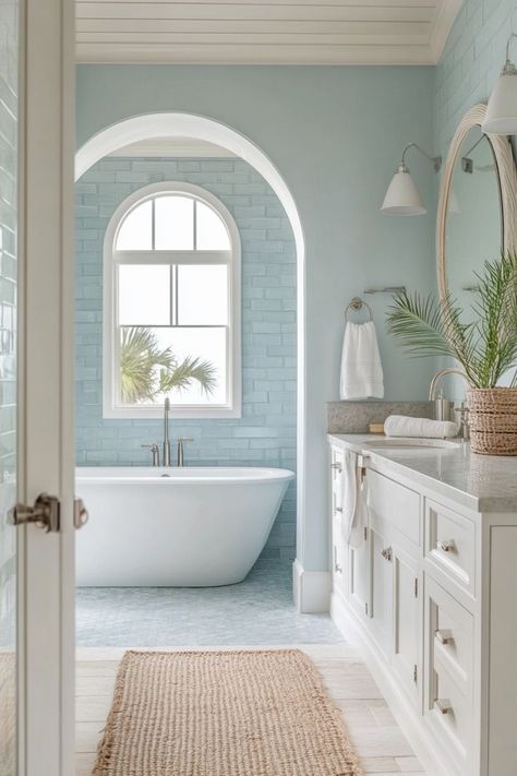 Bring the beach into your bathroom with coastal-inspired decor. Use light, airy colors like white and blue, incorporate natural elements like shells and driftwood, and choose light, breezy fabrics. 🌊🏖️