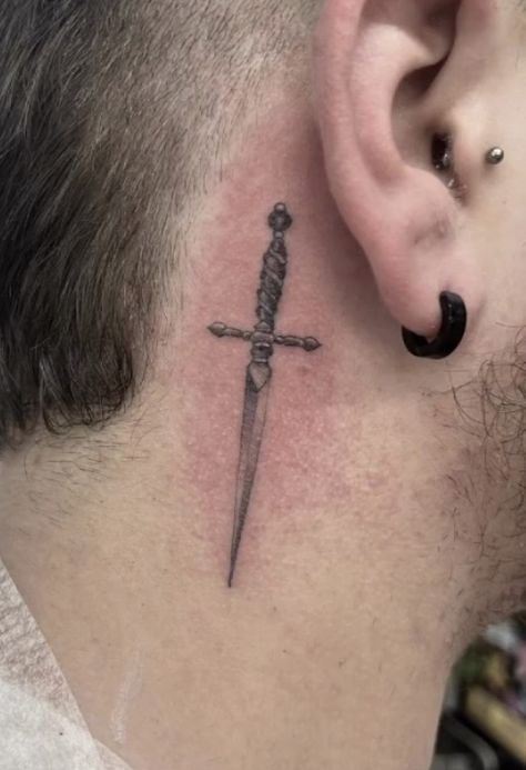 Done by @ rossnagle in allstar tattoo, Limerick, Ireland Single needle, realism, black and grey, dagger / sword Knife Tattoo Behind Ear, Small Swords Neck Tattoo, Knife Neck Tattoo, Dagger Tattoo Men, Dainty Dagger Tattoo, Behind The Ear Tattoo Ideas For Men, Simple Dagger Tattoo, Behind Ear Tattoo Men, Achilles Tattoo