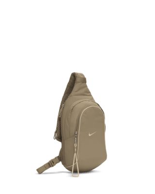 The Nike Sportswear Essentials Sling Bag is a comfortable carry-all with room for storing a reusable water bottle, packable jacket and more. Additional zippered pockets and an adjustable shoulder strap help you stay organized and ready for wherever the day takes you. This product is made with at least 50% recycled polyester fibers. Shown: Khaki/Sanddrift/Sanddrift Style: DJ9796-247 Packable Jacket, Stay Organized, Nike Sportswear, Sling Bag, Sling Backpack, Reusable Water Bottle, Wallets, Shoulder Strap, The Day