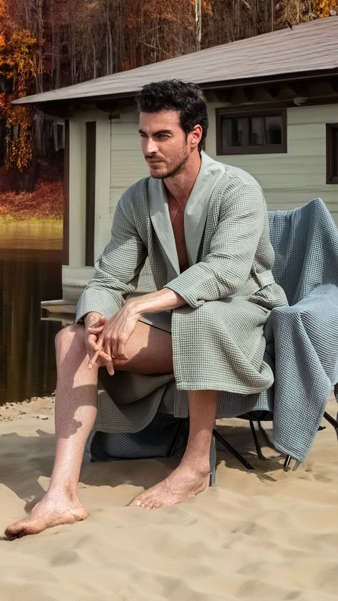 Stylish man standing in front of a wooden lake house, enjoying a tranquil September morning, wrapped in the comfort of a SEYANTE sage-green Turkish Cotton Waffle Bathrobe with a Shawl Collar. The image captures the essence of luxury, ethical craftsmanship, and the meditative calm of nature, encouraging a lifestyle that prioritizes both aesthetic and environmental responsibility. Morning Luxury, Terry Robe, Towel Wrap, Mens Luxury, Comforters Cozy, Shawl Collar, Morning Coffee, Sage Green, Shawl