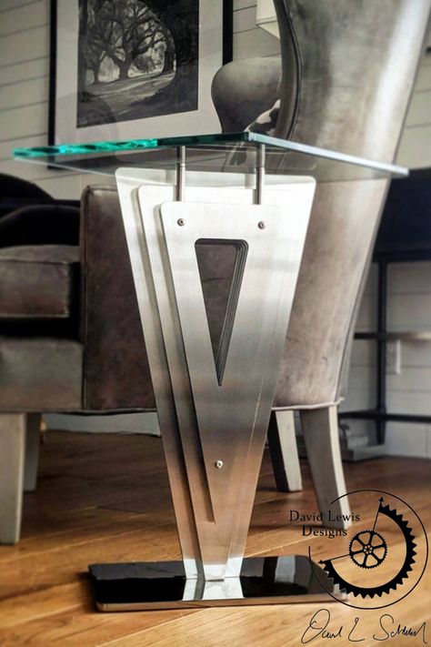 This elegantly handcrafted piece was masterfully handcrafted using stainless steel and hardened glass, paying homage to modernism. Visit David Lewis Designs, online, to view this piece! Gatsby Art, Glass Art Deco, Tower Stand, Console Tables, Coffee And End Tables, Metal Sculpture, Modernism, Gatsby, Diamond Shapes