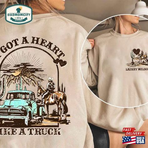 Lainey Wilson Heart Like A Truck Cowboy T-Shirt 2 Side Country Music Shirt Western Sunset Cowgirl Unisex Hoodie Check more at https://dadmomgift.com/product/lainey-wilson-heart-like-a-truck-cowboy-t-shirt-2-side-country-music-shirt-western-sunset-cowgirl-unisex-hoodie/ Lainey Wilson Sweatshirt, Heart Like A Truck, Western Sunset, Lainey Wilson, Country Music Shirt, Country Music Shirts, Diy Things, Cowboys Shirt, A Truck