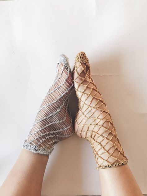 Last week, I posted the pattern to my knitted fishnet socks, and promised a crochet version for all the crocheters out there. The first half of this sock zoomed by, and I was super excited - it was looking fishnetty and was such bliss to crochet.     Then I got to the hem and got stuck for 4 days... the lurex just was not stretch enough to get over my instep and heel, or was too loose and floppy around my ankle. I tried working a front post/back post mock rib, but that was a failure t... Sparkly Fishnets, Crochet Socks Pattern, Fishnet Socks, Crochet Socks, Lace Socks, Fishnet Stockings, Sock Patterns, Crochet Shoes, Crochet Slippers