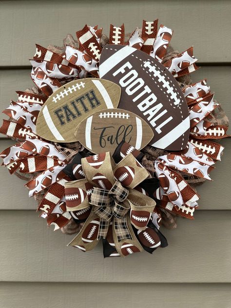 Welcome your friends and family with a Fall/Football Wreath!!  Perfect for a mancave, over your fireplace, den, hang it on your wall or on your front door. The ribbon is a combination of 5 different wired ribbons, Football Sign and Mesh.  Your Wreath will be shipped in a large box, safely secured to the box. Keep the box for easy storage! If the wreath is placed outside, be sure to secure the wreath tightly so that the wind doesn't blow it away. Make sure to have coverage, a covered porch would work best!  It also fits perfectly between most screen and storm door or on your deck to add some summer fun! Remember to fluff your bows when taken out of box. "Favorite My Shop" so you can view all my upcoming projects for all holidays, different seasons and a huge variety of Themes. Unfortunately Wreaths With Mesh Ribbon, Football Season Wreaths, Football Wreaths For Front Door Diy, Football Porch Decor, Sports Wreaths Diy, Football Wreaths For Front Door, Football Wreaths, Ribbon Wreaths, Diy Door Wreaths