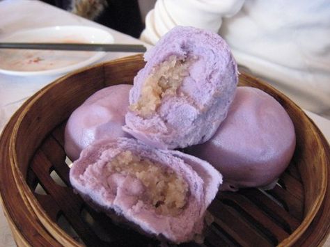 Taro buns, a Chinese dessert.  Sweet buns filled with taro, a sweet root vegetable similar to mashed potato.  You can pick them up frozen at a local asian grocery store and steam them in a rice cooker or covered microwave dish.  Really good! Taro Bun Recipe, Taro Desserts, Taro Bun, Taro Bread, Taro Buns, Asian Bread, Chinese Sweets, Taro Recipes, Asian Pastry