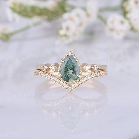 Pear Moss Agate Engagement Ring Set Dainty Green Gemstone Rings Unique 14K Rose Gold Ring Bridal Set Women 2pcs Unique Rings Natural inspired Link to the Moissanite Ring Set: https://www.etsy.com/listing/1690166532/pear-moissanite-engagement-ring-set?click_key= RING DETAILS METAL: available in 14k or 18k solid yellow gold, white gold, rose gold ( Please contact me directly for palladium or platinum.) MOISSANITE: https://www.etsy.com/listing/1154450261 ENGAGEMENT RING CENTER STONE: Moss Agate SIZ Fluorite Ring Engagement, Fairy Engagement Ring Green, Dainty Gemstone Engagement Rings, Engagement Rings Moss Agate, Emerald Gemstone Engagement Ring, Pear Moss, Green Moissanite Ring, Green Engagement Rings, Gemstone Rings Unique