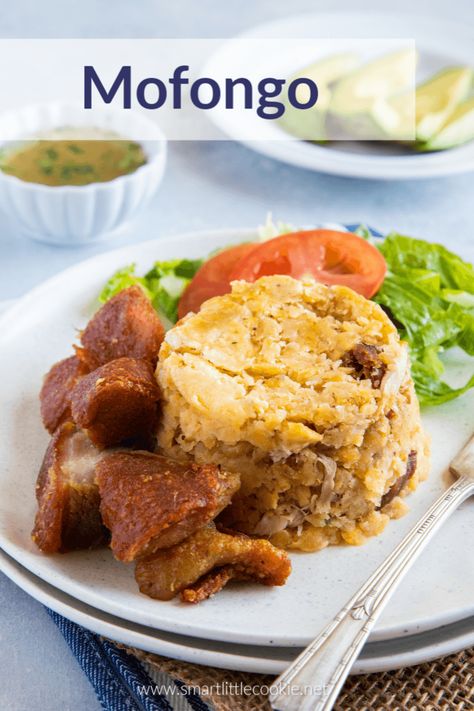 Mofongo is an easy traditional Puerto Rican dish made with delicious fried green plantains mashed with garlic, pork crackling (chicharron), and served with an easy garlic mojo sauce. This recipe is very similar to the mofongo Dominicano and can be made in under 30 minutes! #smartlittlecookie #puertorican #recipe #dinner #caribbean #food #Dominicano How To Make Mofongo, Mofongo Recipe, Dominicano Recipes, Mashed Plantains, Fried Plantains, Puerto Rican Dishes, Plantain Recipes, Puerto Rico Food, Boricua Recipes