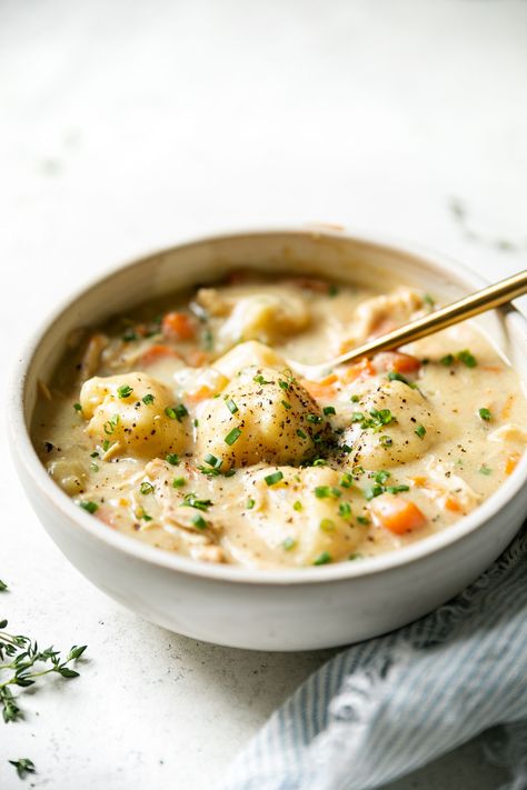 The ultimate cozy meal for comfort food season: Italian Chicken and Gnocchi Dumplings! The creamiest homemade chicken soup with a little bit of Italian flair – it is infused with Italian spices & parmesan, & finished with pillowy, fluffy fresh gnocchi dumplings. This chicken and gnocchi soup is a creamy, comforting one-pot wonder, & it's ready in 60 minutes or less! #chickenanddumplings #easychickensoup #homemadechickensoup #gnocchi #gnocchisoup #chickenandgnocchisoup #comfortfoodrecipes Chicken And Dumplings Aesthetic, Easy Cozy Meals, Dumpling Universe, Chicken Soup Aesthetic, Cozy Meals Comfort Foods, Italian Dumplings, Creamy Chicken And Gnocchi, Fresh Gnocchi, Emma Gonzalez