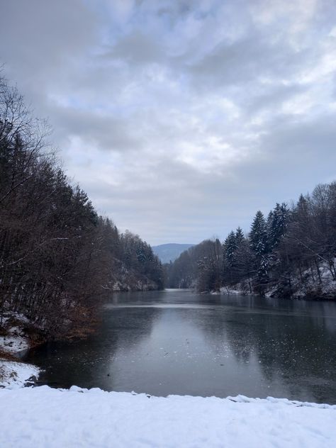 A frozen lake Ice Skating Frozen Lake, Frozen Lake Aesthetic, Lake Ice Skating, Ice Aesthetic, Lake Aesthetic, Skating Aesthetic, Winter Lake, Frozen Lake, Snowy Day