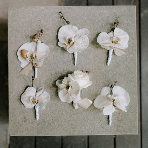 The boutonniere meticulously mirrors the floral composition of her bouquet, featuring the delicate harmony of Blush Ecuador Roses, Old Rose White blossoms, Beige Orchids, and White Bleached Amaranthus. Amaranthus Bouquet, Floral Composition, Bali Wedding, Old Rose, White Orchids, Hearts Desire, Bespoke Design, Boutonniere, Ecuador