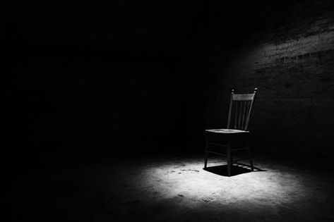 Red Door Yellow Door, Single Spotlight, Old Basement, Photography Themes, Yellow Doors, Man Sitting, Empty Room, Single Chair, Soft Carpet