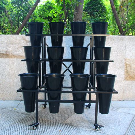 PRICES MAY VARY. 3 Tier Sturdy metal frame: Heavy Duty Construction. 35.43 x 22.44 x 34.65 inches 12 Pcs Plastic Buckets. Each conic vase Dia. 8" Tall 14". Powder coated steel frame:Rustproof and weather resistant. Easy Assembly: Components and instructions are included for quick installation. Swivel casters rotate 360 degrees.This flower display stand moves very easily, 4pcs casters with brakes. The wheels rolls smoothly and does not mar the wood floors. Zhongma Moving Plant Stand with Wheels H Cart Display, Flower Display Stand, Moving Plants, Plant Stand With Wheels, Led Plant Lights, Flower Shelf, Tall Plant Stands, Hanger Stand, Garden Cart