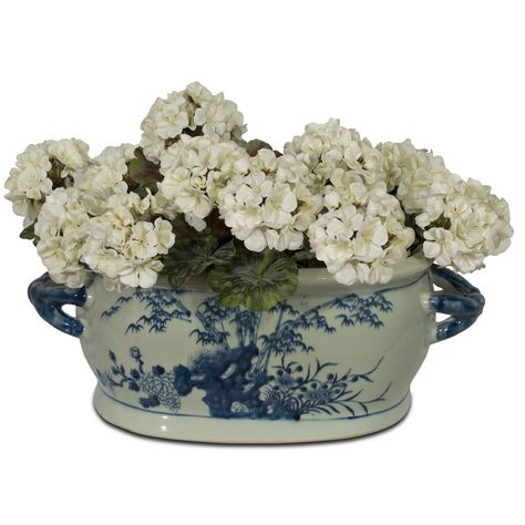 Featuring handpainted bird and flower motifs throughout, this classic blue and white porcelain footbath planter is a work of art worth collecting. The planter features paintings of four Chinese flowers, plums, chrysanthemums, peonies, and bamboo trees on its front and back. Two matching blue handles in a braided style complete the overall design. The spacious interior basin, measuring 13"W x 8"D x 6"H, is the perfect home for any medium-sized house plant or as the base for your floral arrangemen Footbath Planter, Chinese Flowers, Orchid Planters, Bird And Flower, China Furniture, Bamboo Tree, Flower Motifs, Red Lantern, Blue Garden