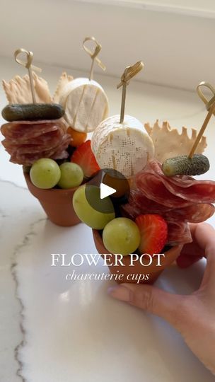 1.4M views · 91K reactions | FLOWER pot charcuterie cups are the cutest way to display cheesy appetizers this spring! 🌸🪴🧀

Perfect to serve up for Mother’s Day, bridal showers, backyard bbqs or any spring get togethers with friends! 

Comment LINK and I will send you a dm with the link to these cutie flower pots 🪴

What I included: 

🧀 pecans
🧀 mini pickles
🧀 salami
🧀 crackers
🧀 blueberries
🧀 mini brie
🧀 grapes
🧀 strawberry 

SAVE so you can recreate these cuties and follow @convinoboard for more ✅🧀🪴

•
•
#cheeseboard #cheese #entertainingathome #dinnerparty #appetizer #foodie #charcuterieboard #grazingtables #easyappetizers #cheeseplatter #mothersday #bridalshower #gardenparty | Nicolle | Cheese, Wine, Appetizers & Dinner Parties | Badger · These Words Flower Pot Charcuterie, Charturie Boards, Retirement Crafts, Easy Appetizers Recipes, Cheesy Appetizers, Mini Pickles, Charcuterie Cups, Antipasto Skewers, Cheesy Appetizer