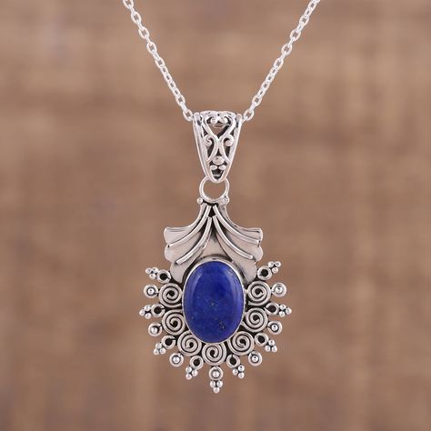 Add a bold, majestic flair to your look with this gorgeous pendant necklace from Indian designer Aparna. Expertly crafted by hand, the lovely pendant features a crown of sterling silver that sits gracefully above an oval cabochon of lapis lazuli. Swirls of sterling silver border the beautiful gemstone, with petite balls of silver completing the elegant design. Jewelry Shelves, Pig Jewelry, Lapis Jewelry, Lapis Lazuli Jewelry, Lapis Lazuli Pendant, Lapis Lazuli Gemstone, Blue Pendant, Silver Jewelry Pendant, Sterling Silver Necklace Pendants