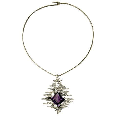 A square cut amethyst, pavé-set diamond, and 18 karat white gold pendant, on an 18 karat white gold torque, by Andrew Grima, 2002. Amethyst weighs approximately 35.00 carats, diamonds weigh approximately 5.30 carats total. The pendant of this necklace measures 3"L x 2.4"W and the torque has a circumference of approximately 16.5". Stamped Grima, 750, makers mark AG ltd, London hallmarks dated with the letter "c" for 2002. The Letter C, White Gold Pendant, Gold Diamond Necklace, Letter C, Diamonds And Gold, Yellow Gold Pendants, Victoria And Albert Museum, Square Cut, High Jewelry