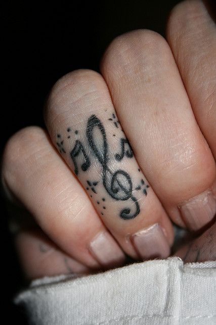 . Rockstar Gf Tattoo Ideas, Music Finger Tattoo, Music Note Finger Tattoo, Emo Finger Tattoos, Emoticon Tattoo, Music Themed Tattoos, Music Related Tattoos, Music Lover Tattoo, Treble Clef Tattoo