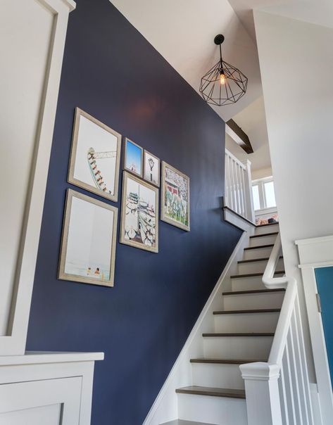 This old classic shingle-style home – staircase Navy Staircase Wall, Navy Blue Hallway Ideas, Staircase Wall Paint, Blue Staircase, Caged Chandelier, Blue Hallway, Open Trap, Hallway Colours, Blue Accent Walls