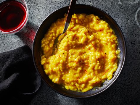 Saffron, wine, and beef tallow enrich this golden risotto with comforting flavor. Get the recipe at Food & Wine. Zucchini Risotto, Bacon Risotto, Saffron Risotto, Vegetarian Risotto, Risotto Milanese, Pasta And Beans, White Wine Recipes, Creamy Zucchini, Tomato Risotto