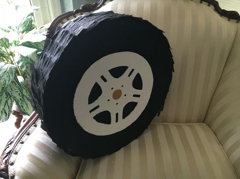 Tire piñata I made for my boyfriends auto technician graduation party! Tire Pinata, Vintage Car Pinata, Hotwheels Monster Truck Birthday Party, Wheel Pinata, Hot Wheels And Monster Truck Party, Piñata Cars, Mechanics Birthday, Blaze Party, Monster Jam Party