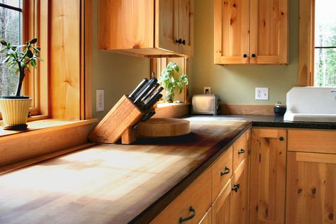 Pine warms this kitchen with a counter top joining butcher block and custom concrete counter tops. Kitchen by Emerald Builders. Home design by South Mountain Company. Wood Countertops And Cabinets, Hickory Cabinets Butcher Block Counter, Wood Kitchen Cabinets With Butcher Block, Butcher Block Wood Cabinets, Butcher Block Countertops On Wood Cabinets, Butcher Block Countertops With Natural Wood Cabinets, Butcher Block With Wood Cabinets, Wood Cabinets And Butcher Block, Wood Countertops With Wood Cabinets