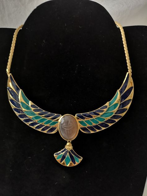 "Egyptian Winged Scarab Phoenix Egyptian Revival Cloisonne Enamel Pendant Gold necklace Ethnic Costume jewelry Luxury Evening jewelry dress Cocktail 22 carats gold plated metal, handmade cloisonne enamel, sculpted onyx cabochon. Signed jewelry by FM87 Dimensions Height 7.4\" / 19 cm Width 5.1\" / 13.2 cm Length open 13.3\" / 34.5 cm It is a vintage item, it is sold as is. Since most items have been previously used over time, they may show signs of wear. I make every effort to describe and photog Egyptian Jewelry Modern, Gold Leaf Decor, Egyptian Inspired Jewelry, Egyptian Drawings, Winged Scarab, Egyptian Revival Jewelry, Ancient Egyptian Jewelry, Jewelry Dress, Egyptian Necklace