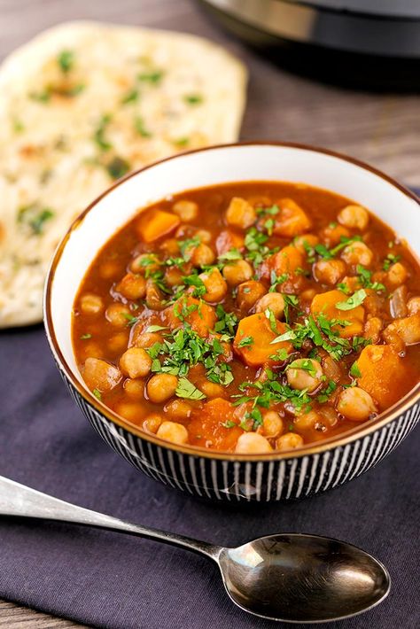 Moroccan chickpea stew recipe - a warm, comforting stew you’ll love. It offers the perfect blend of carefully chosen and proportioned spices to create a delectable vegan recipe that will cozy up even the coldest winter night. This hearty recipe comes together in less than 20 minutes so you can enjoy it anytime- even on the busiest of weekdays. Moroccan Chickpea Stew, Moroccan Chickpea, Wild Mushroom Soup, Vegetarian Soups, Vegan Stew, Chickpea Stew, Ras El Hanout, Chickpea Recipes, Stew Recipe