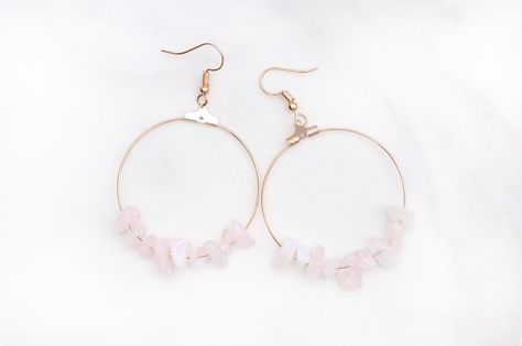 Rose Quartz Stone Hoop Earrings   These pretty earrings add a boho touch to your outfits! The soft pink stones are neutral enough to wear with almost anything.   Rose Quartz meaning:  Love + Harmony + Calm + Healing  You can choose your metal either gold or silver, earrings are sold as a pair.  Each earring is unique and different as the stone beads are all different shapes, colors, and sizes. Rose Quartz Meaning, Raw Crystal Earrings, Quartz Meaning, Stone Hoop Earrings, Gemstone Hoop Earrings, Pink Stones, Rose Quartz Stone, Chip Beads, Pretty Earrings