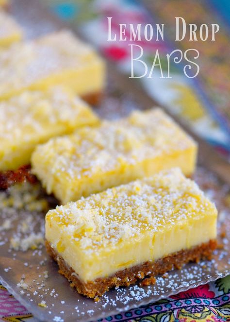 These Lemon Drop Bars are extra creamy and topped with candied lemon zest for the BIGGEST lemon flavor possible! So easy to make, deliciously sweet and tart, you'll find this treat hard to resist! // Mom On Timeout Cake Pan Recipes, Creamy Lemon Squares, Candied Lemon Zest, Nilla Wafer Crust, Easy Toffee, Lemon Bars Easy, Lemon Cheesecake Bars, Biscuits Graham, 8 Cake