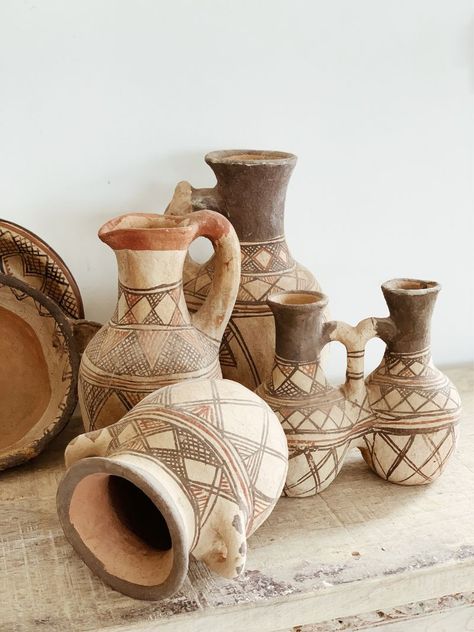 Our collection of Rif Pottery is created completely by hand by the Berber women of the Rif Mountains in Morocco. Originally used to store and transport water and oils or preserve olives, dates, sugar and spices, today these organic vessels stand to make a statement in your interior spaces. Each piece is hand painted from natural dyes and no two pieces are the same meaning you can bring home a truly unique and one-of-kind work of art. Invite culture and age old traditions into your home with Rif Organic Vessels, Berber Pottery, Art Proposal, Traditional Cafe, Hall Ways Ideas, Berber Art, Morocco Decor, Water Vessel, Pottery Patterns