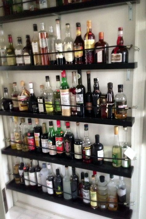 Liquor shelving - earthquake proof Bar Shelves Ideas Liquor, Liquor Shelf Ideas, Bar Shelves Ideas, Liquor Storage, Liquor Shelf, Home Bar Areas, Bar Shelves, Wooden Wine Rack, Wall Mounted Wine Rack