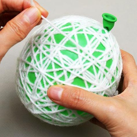 Yarn or String Christmas Ornaments | Kids' Crafts | Fun Craft Ideas | FirstPalette.com Yarn Ornaments Diy Kids, Yarn Christmas Crafts For Kids, Christmas Yarn Crafts, String Ornaments, Ornaments Diy Kids, Yarns Ornaments, Fun Craft Ideas, Light Bulb Ornaments, Christmas Yarn