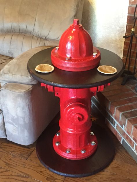 Fire hydrant end table with bunker gear coasters Fire Hydrant Table Base, Fire Hydrant Table, Old Fire Hydrant Ideas, Fire Hydrant Ideas, Fire Dept Decor, Firefighter Man Cave, Fireman Decor, Firefighter Room, Beer Decor