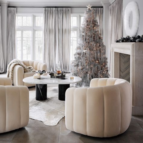 Fitz Modern Cream Velvet Swivel Chair + Reviews | CB2 Cb2 Christmas, Cream Coffee Table, Oval Marble Coffee Table, Tree Tinsel, Velvet Swivel Chair, Flocked Christmas Tree, Feather Wreath, Pine Christmas Tree, Tinsel Tree