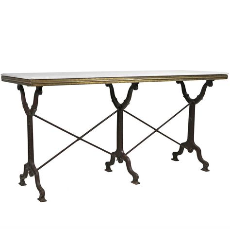 The Long Avignon Marble Bistro Console Table exudes 1920 era French bistro charm. A gorgeous marble top surrounded by elegant brass edging is affixed to a solid cast iron base. The 3-leg design offers both style and function. #frenchcountry, #consoletable White Pedestal Table, French Bistro Table, Marble Bistro Table, Bistro Dining Table, Elegant Outdoor Furniture, Bistro Tables, Hammered Iron, Table Bistrot, Large Decor