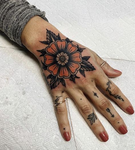 Traditional Top Of Hand Tattoo, Hand Tattoos For Women American Traditional, Trad Tattoo Hand, Traditional Tattoo On Hand, American Trad Hand Tattoo, American Trad Elbow Tattoo, Traditional Finger Tattoos Women, Hand Tattoos For Women Traditional, Hand Tattoos American Traditional