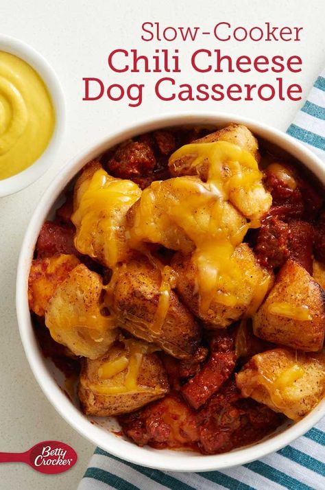 Clear a spot in your dinner rotation: This slow-cooker spin on a beloved fair favorite is going to be a regular that gets raves (and leaves clean plates) every time! Using fridge staples that always seem to be on hand (like hot dogs, ground beef and tomato sauce), this casserole has a saucy, flavorful base that gets topped with Pillsbury™ Grands!™ Homestyle refrigerated Southern Style biscuits. Chili Dog Casserole With Biscuits, Chili For Hot Dogs Recipes Crock Pot, Chili Cheese Dog Bake Biscuits, Chili Cheese Dog Casserole With Biscuits, Chili Cheese Hot Dog Tater Tot Casserole, Chili Cheese Dog Casserole, Chili Cheese Dogs, Cheese Dog, Crockpot Chili