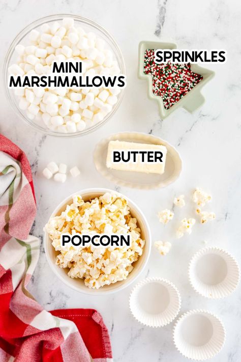 These delicious homemade Christmas popcorn balls combine marshmallow, popcorn, and butter in a recipe easy enough kids can make it! Marshmallow Popcorn Balls Christmas, Oreo Popcorn Balls, Marshmallow Balls Recipe, Marshmallow Popcorn Balls Easy, Marshmallow Cream Popcorn, Popcorn Marshmallow Balls, Microwave Popcorn Balls, Popcorn Balls With Marshmallows, Popcorn And Marshmallow Recipe