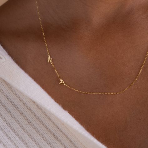 Add a touch of personal elegance to your attire with our Sideways Initial Heart Necklace, a beautifully designed piece that blends a heart-shaped pendant with your chosen initial. Crafted with precision and attention to detail, it's a versatile accessory that symbolizes love and individuality ♡ Material: High Quality Solid 925 Sterling Silver Finish: Sterling Silver ∙ 18K Gold ∙ Rose Gold Dimension: 7mm letter height Design will come in all capital letters unless specified otherwise Size: The to Satellite Necklace, Boyfriend Initials, Relationship Jewelry, Initial Tag Necklace, Letter Necklace Initials, K Necklace, Initial Heart Necklace, Promise Necklace, Fingerprint Necklace