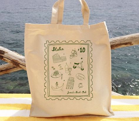 The cutest add on to your bachelorette, wedding, or girls trip! Fill these custom Italy stamp totes with all things needed for your vacay! Add personalized text and change the color! 🇮🇹 Current processing times: 1-2 business days PLEASE PLEASE READ ALL OF THIS BEFORE YOU PURCHASE!😊 - PLEASE NOTE COLOR CHART IS FOR THE DESIGN NOT THE BAG :) Bags are all the same white/cream color - Personalization is for any extra text you are wanting to add to the design to make it special to you! - Font is f Italy Themed Bridesmaid Proposal, Italy Welcome Party, Italy Wedding Favors, Italy Bridesmaid Proposal, Chic Party Bags, Custom Wedding Favors, Bachelorette Bag Ideas, Wedding Bags For Guests, Italy Bachelorette