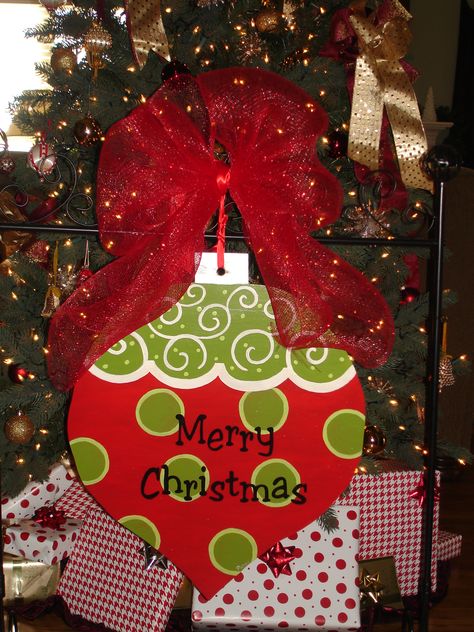 Large Christmas Baubles Diy, Dollar Tree Wood Ornament Cutout, Large Wooden Ornament Door Hanger, Large Wood Ornament Sign, Wood Ornament Door Hanger, Ornament Door Hanger Ideas, Dollar Tree Christmas Wooden Cutouts, Wooden Ornament Door Hanger, Ornament Door Hanger