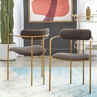 The Retro Velvet Dining Arm Chairs by Simple Living make a bold impression on your dining room, while providing a comfortable seat for every meal. Modern and glam, they are crafted with Gold finished metal frames and luxuriously soft Velvet upholstery, available in your choice of three (3) colors: Dusty Pink, Light Blue, Navy, Fig, Grey or Taupe. Curved seat backs and gentle curves in the frames give the chairs their alluring silhouette. Set includes two (2) chairs. Features Set includes: two (2 Mismatched Dining Chairs, Contemporary Dining Sets, Elegant Chair, Grey Armchair, Jewelry Clothing, Upholstered Side Chair, Best Dining, Upholstered Arm Chair, Dining Room Bar