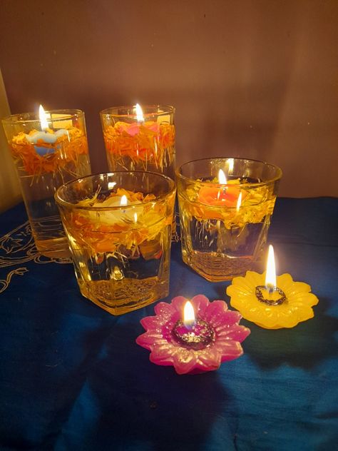 Flowers and floating candles decoration in glass International Hairstyles, Candles For Diwali, Floating Candle Decorations, Sanatan Dharam, Chaturthi Decoration, Candles Decoration, Ganesh Chaturthi Decoration, Diwali Candles, Diwali Photography