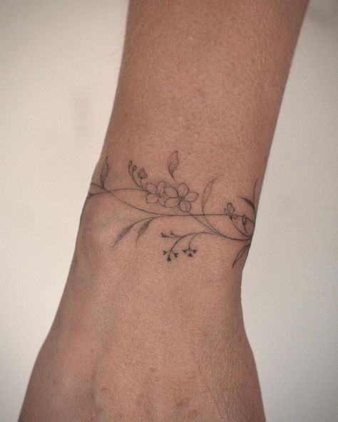 Wrapped Wrist Tattoos For Women, Wrap Around Bracelet Tattoo, Wrap Around The Wrist Tattoos, Celtic Wrist Tattoos For Women, Small Vine Tattoos For Women, Floral Arm Cuff Tattoo, Branch Wrist Tattoo, Tattoo Bands Women, Tattoo Date Ideas