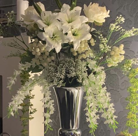 Artificial flower display in silver vase Lilly Flower, Centerpieces Wedding, Silver Vase, Flower Centerpieces Wedding, Flower Display, Flower Centerpieces, Floral Arrangement, Wedding Centerpieces, Flower Vases