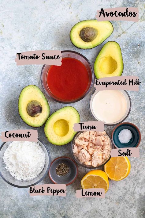 This is a unique twist of a classic lunch, including avocado stuffed with tuna, tomato sauce, and coconut! Give it a try for an exciting and flavorful meal. Tuna Stuffed Avocado, Tuna Tomato, Avocado Stuffed, Stuffed Avocado, Avocado Tomato, Evaporated Milk, Flavorful Recipes, Tomato Sauce, Black Pepper