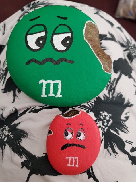 Kindness rock, painted M&M rock, broken  M&M M And M Rocks Painted Stones, M And M Painted Rocks, Painted Rocks M&m, Rock Painting Ideas Characters, M And M Rock, M M Rock Painting, Happy Stone, Garden Rock Art, Diy Rock Art