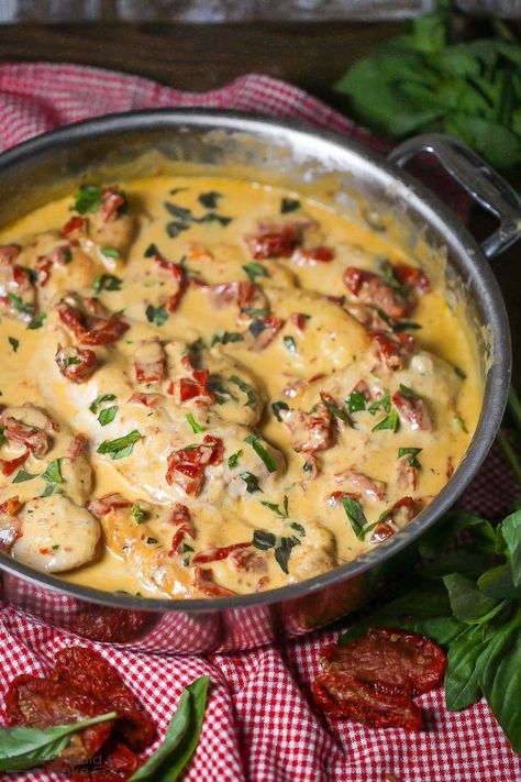 Close up of chicken with creamy sun-dried tomato sauce simmering in a saute pan sprinkled with fresh basil. #sundriedtomatoes #chickendinner #weeknightdinner #chickenrecipe #easyrecipes Tomato Basil Chicken, Sun Dried Tomato Sauce, Basil Recipes, Sticky Buns, Dried Tomatoes, Creamy Sauce, Sun Dried, Fresh Basil, Chicken Dinner Recipes